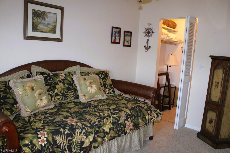 Carpeted bedroom with baseboards
