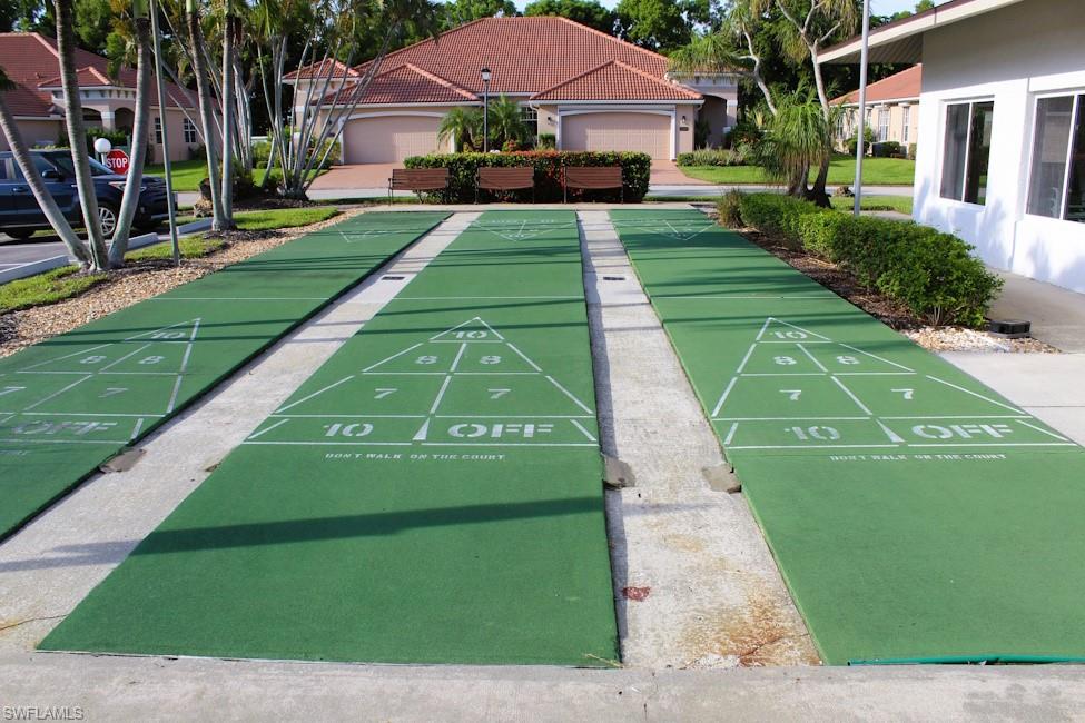 View of home's community with shuffleboard