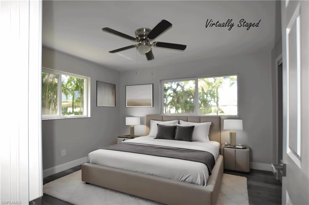 Bedroom with LVP floors and ceiling fan