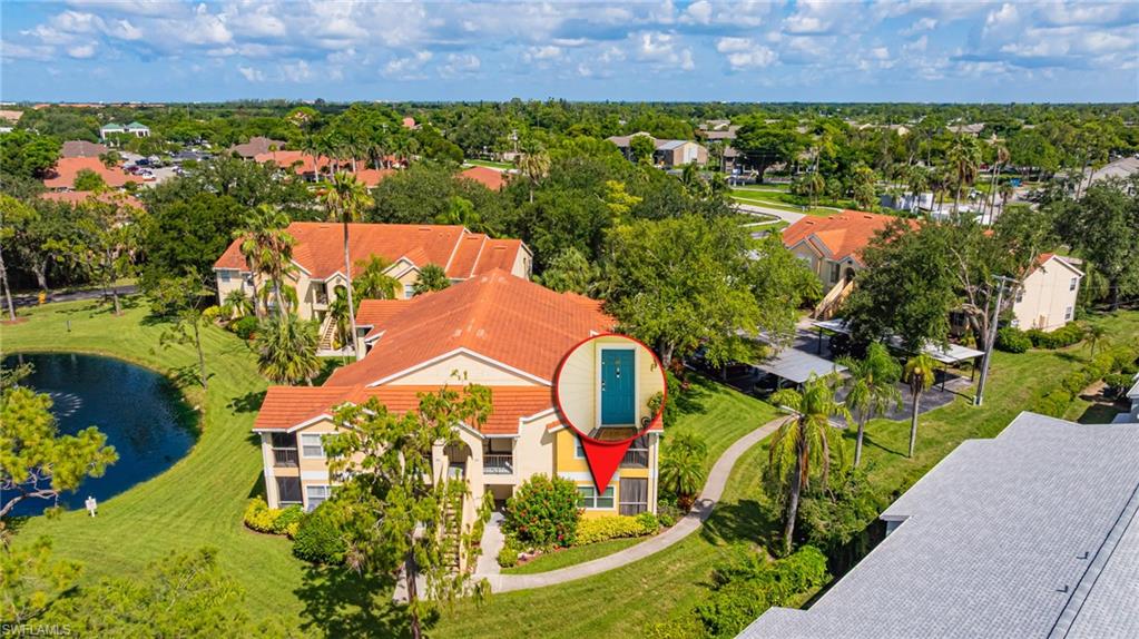 Aerial perspective of suburban area with a large body of water