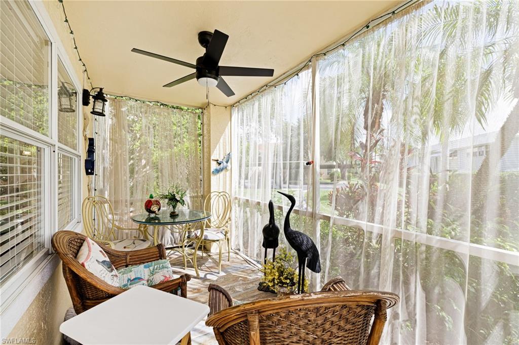 Sunroom / solarium with a ceiling fan
