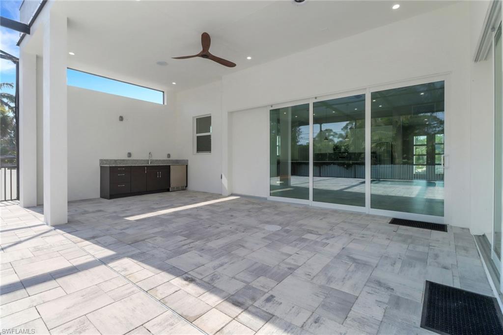 View of patio featuring a ceiling fan