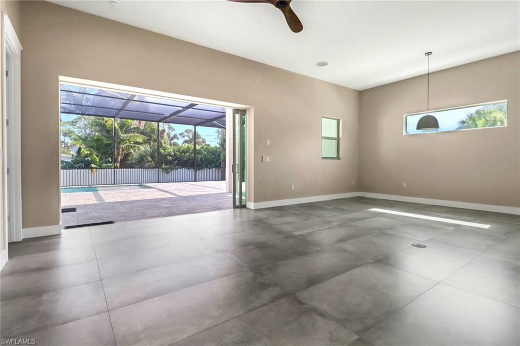 Empty room with baseboards and ceiling fan