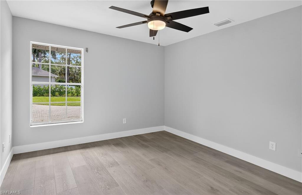 Guest bedroom with a ceiling fan.Guest bedroom with ceiling fan