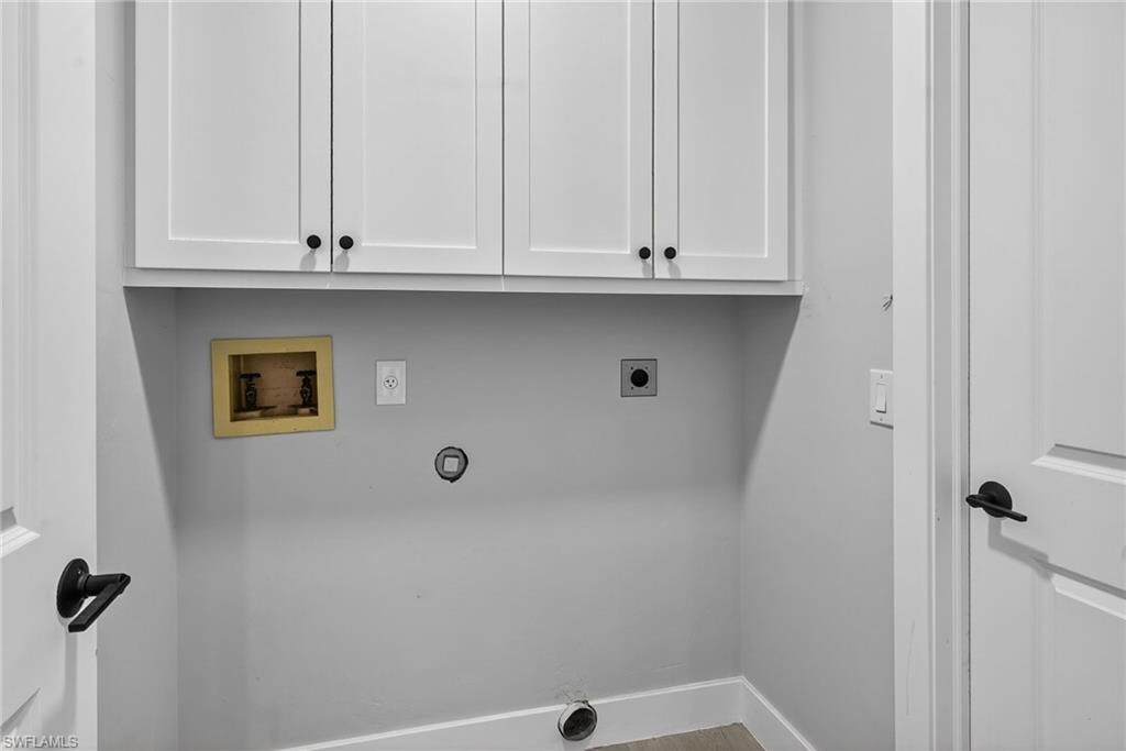 Laundry room with washer and dryer hookup, and cabinet space.Laundry room with washer and dryer hookup and cabinetry