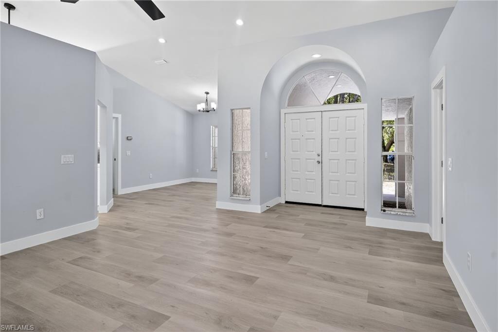 Entrance foyer with recessed lighting, and vaulted ceiling