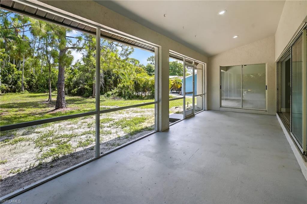 Screened in patio with vaulted ceilings.