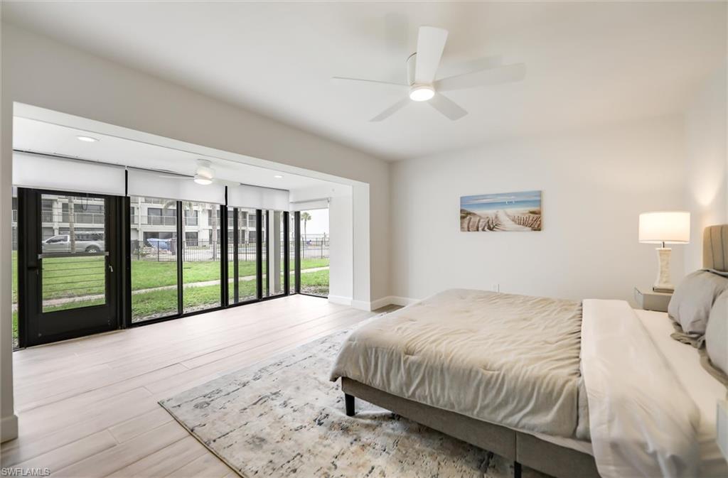 Bedroom featuring wood finished floors and a ceiling fan