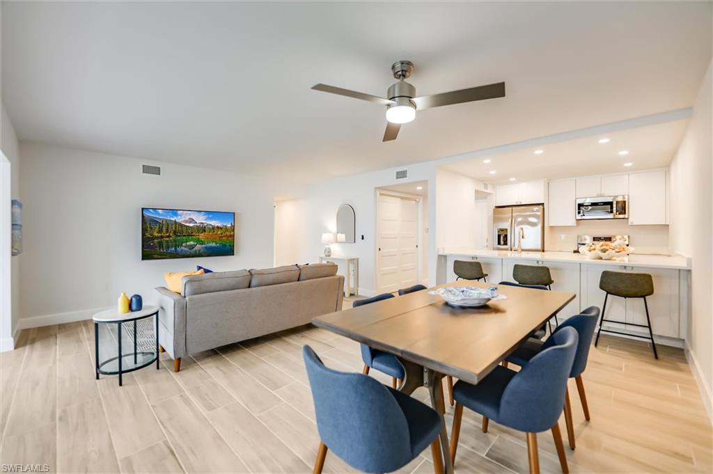 Dining space featuring light wood-style floors and a ceiling fan