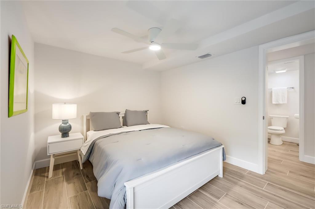 Bedroom with light wood-style flooring and a ceiling fan