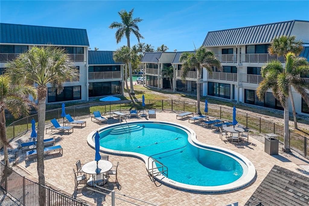 Community pool featuring a patio