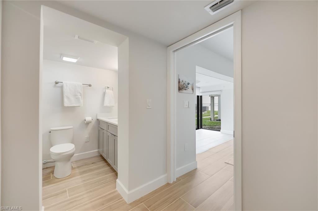 Bathroom with vanity and wood finished floors