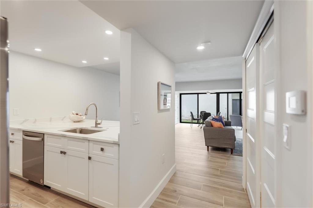 Dining room featuring light wood-style floors, a ceiling fan, and recessed lighting