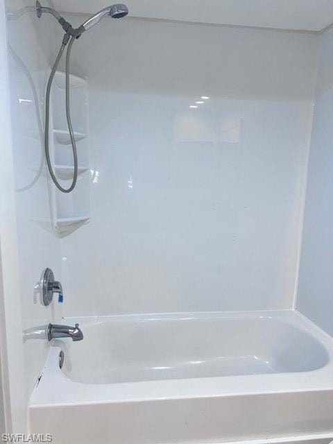 Bathroom featuring shower / washtub combination