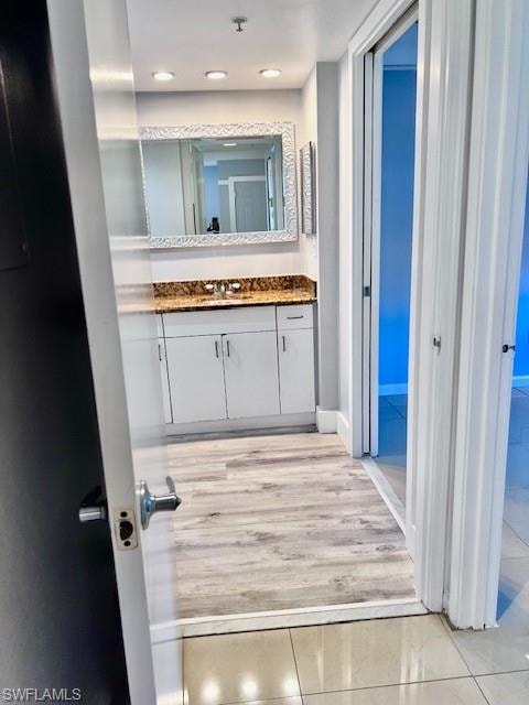 Bathroom with vanity and recessed lighting