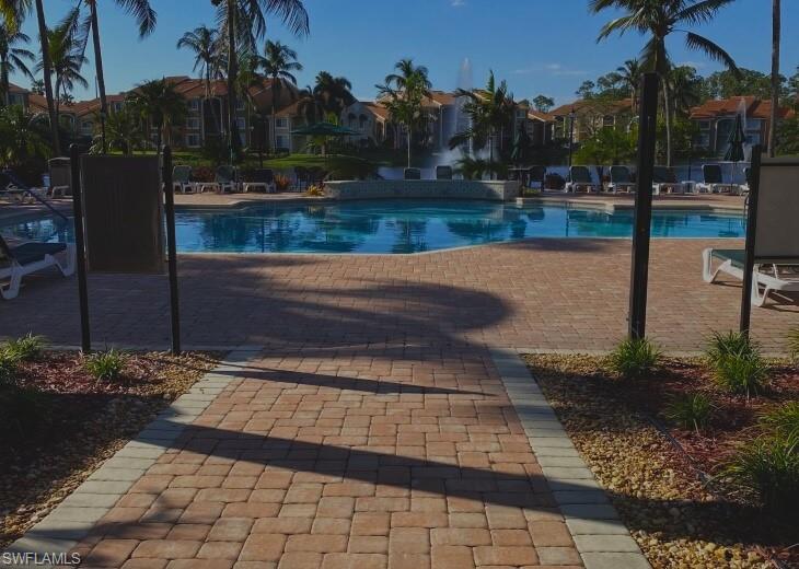 Community pool with a patio area