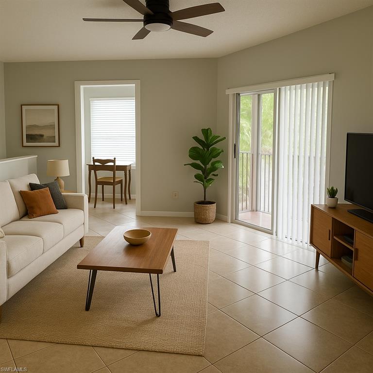 Living room with light tile patterned floors and ceiling fan