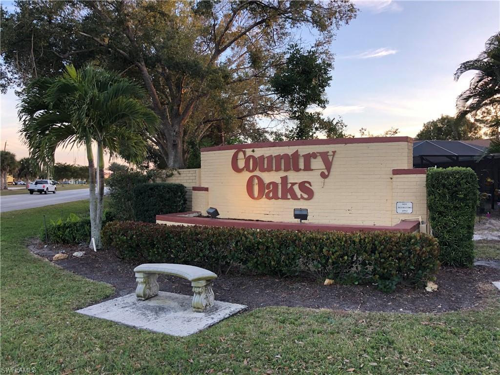 Community / neighborhood sign with a lawn