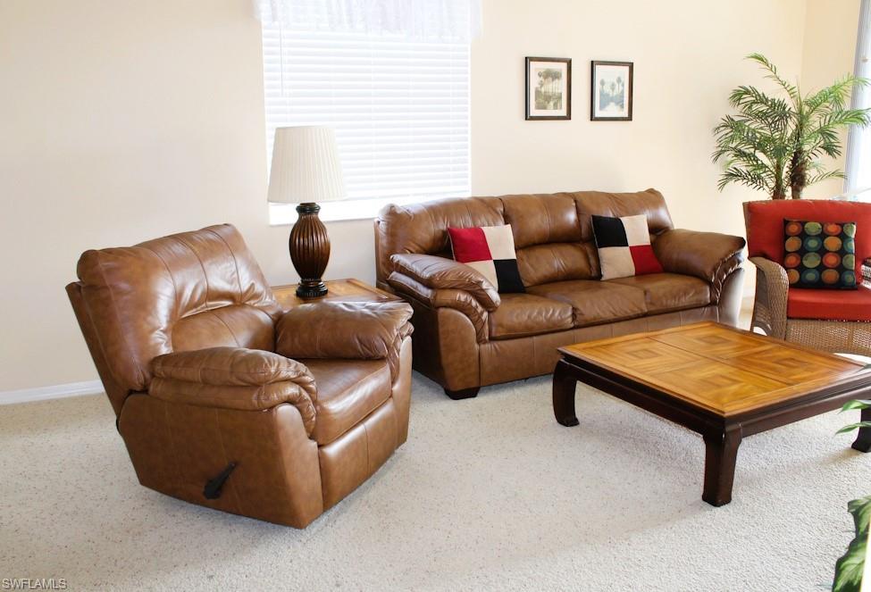 Living room featuring carpet floors