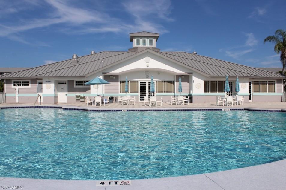 Community pool featuring a patio area