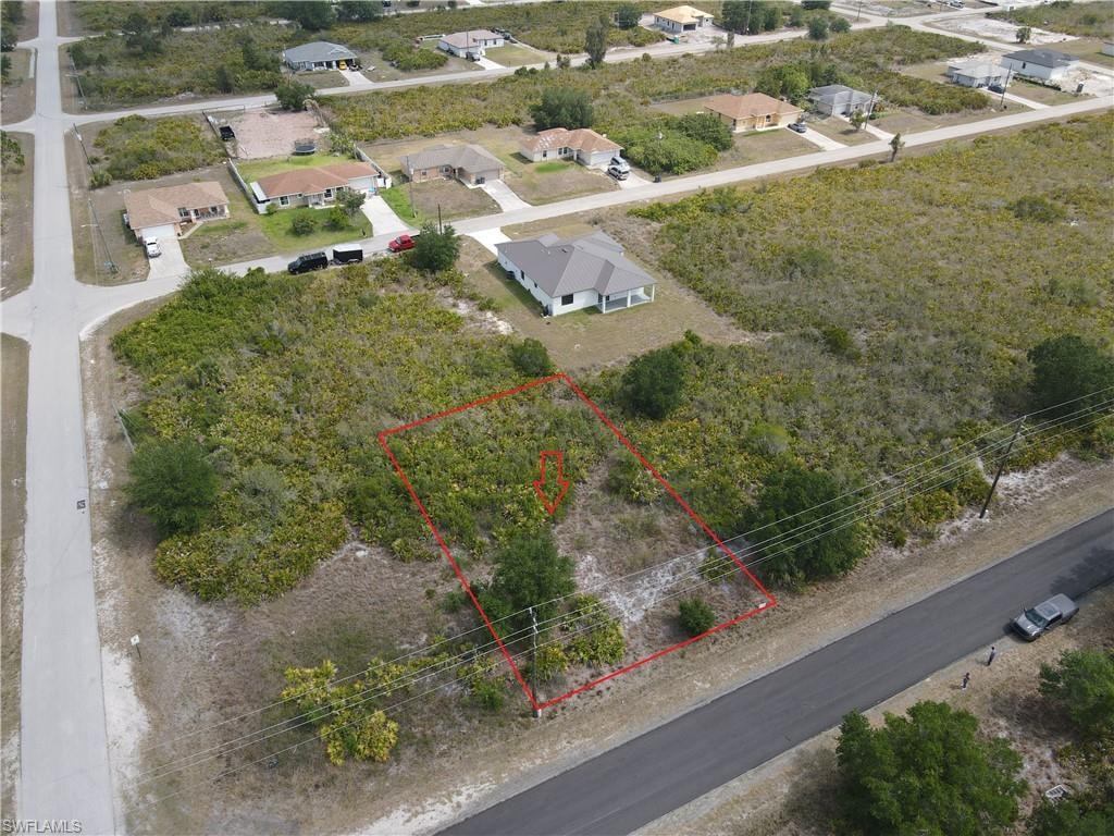 Aerial perspective of suburban area with property boundaries highlighted