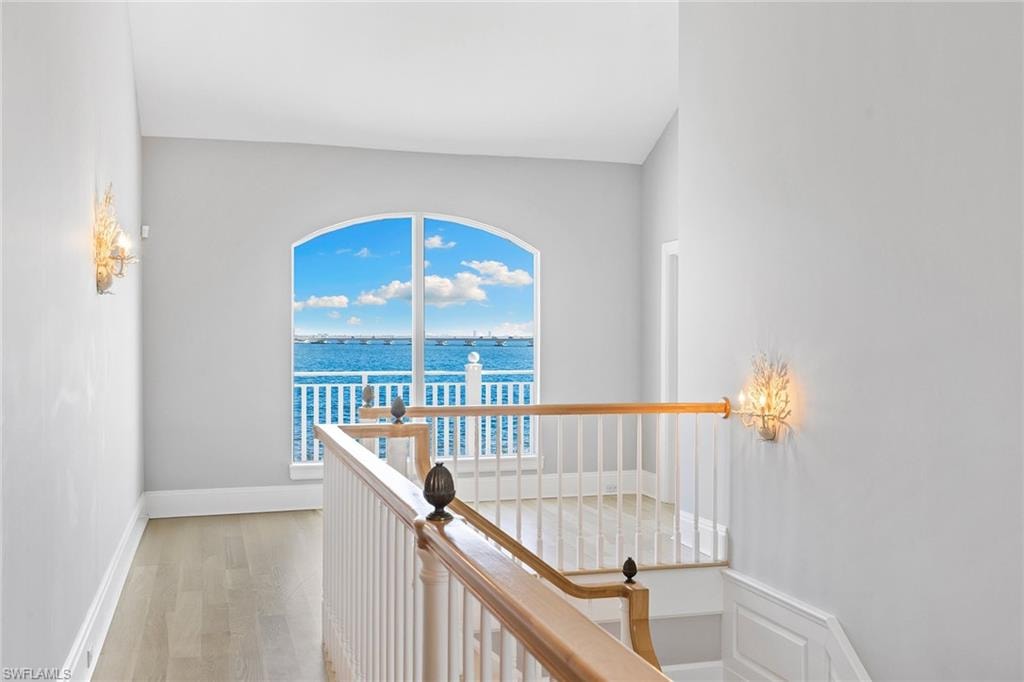 Hallway featuring a water view and light wood finished floors