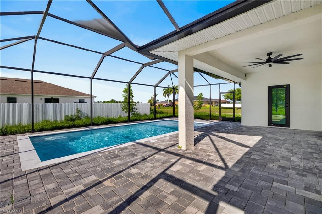 Functional utility space featuring light grey walls, white trim, and grey tiled flooring