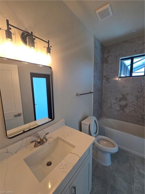 Bathroom featuring a single vanity with a white countertop and integrated sink, a dark-framed mirror, and a three-bulb vanity light fixture