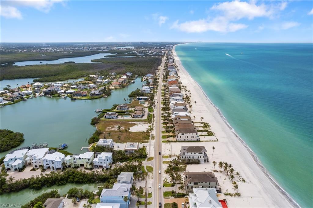 Aerial view of residential area with unending shoreline