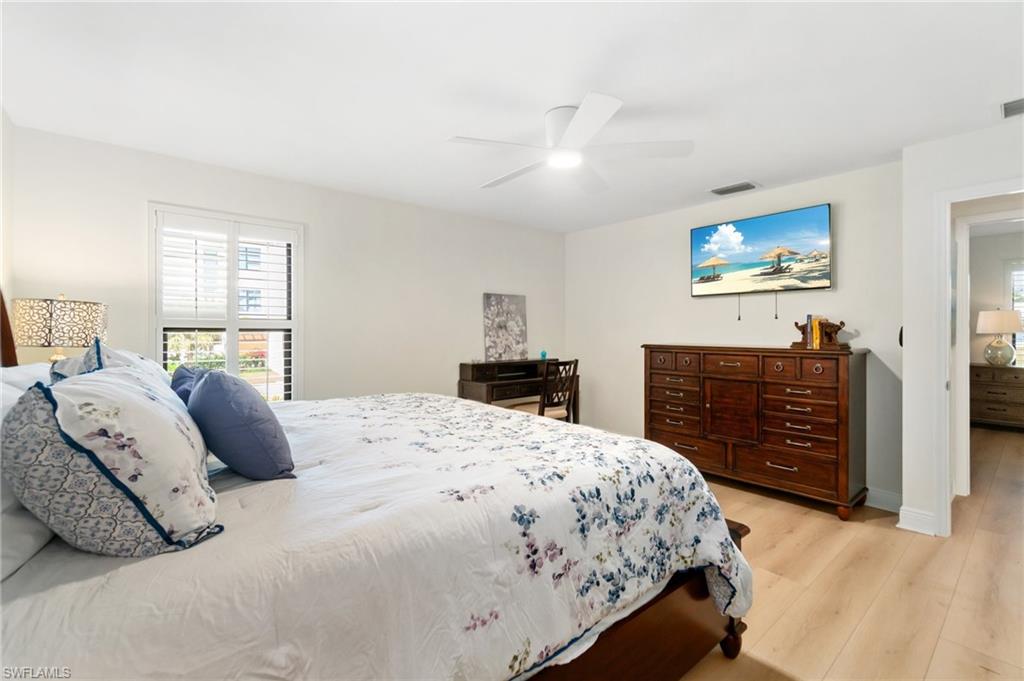 Bedroom with light wood-style flooring and ceiling fan