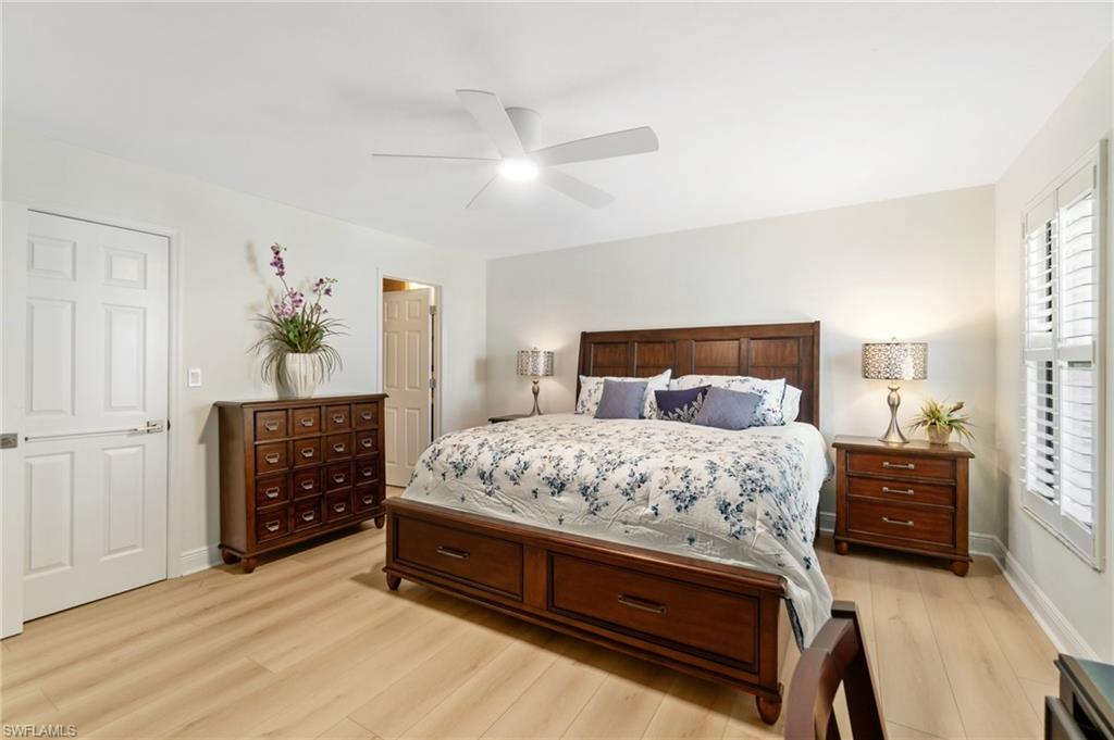Bedroom featuring light wood finished floors and a ceiling fan