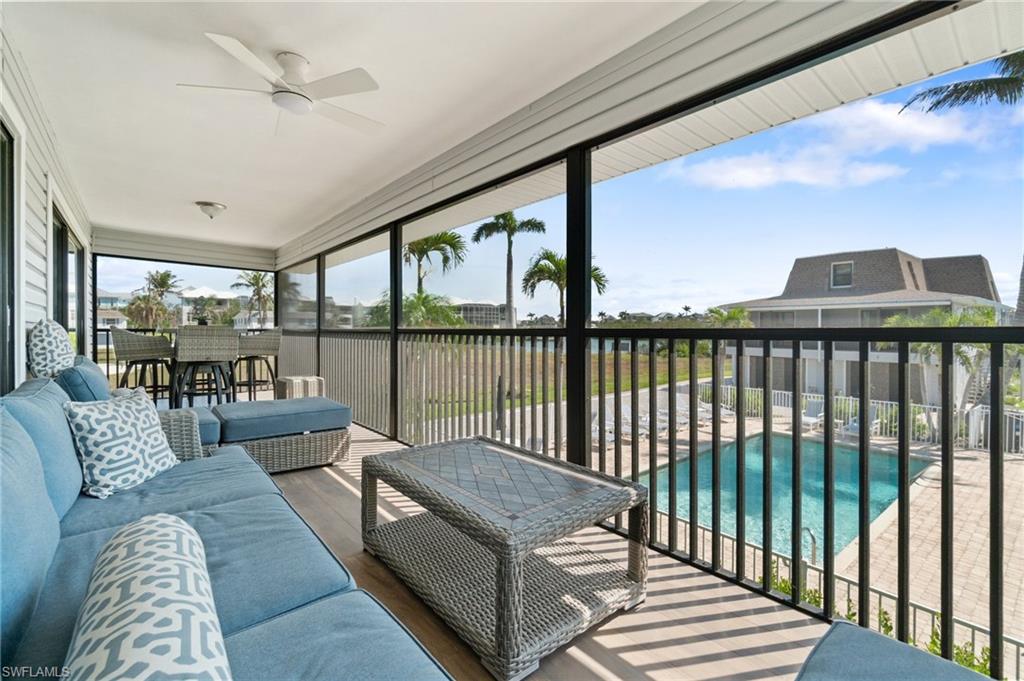 Sunroom featuring ceiling fan and an outdoor hangout area
