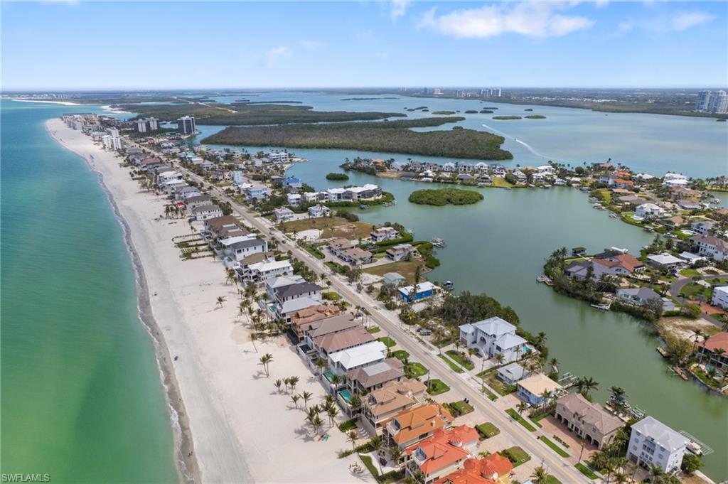 Aerial view of residential area with expansive coastline