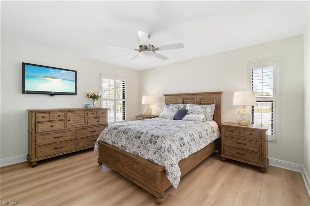 Bedroom featuring light wood-style flooring and a ceiling fan