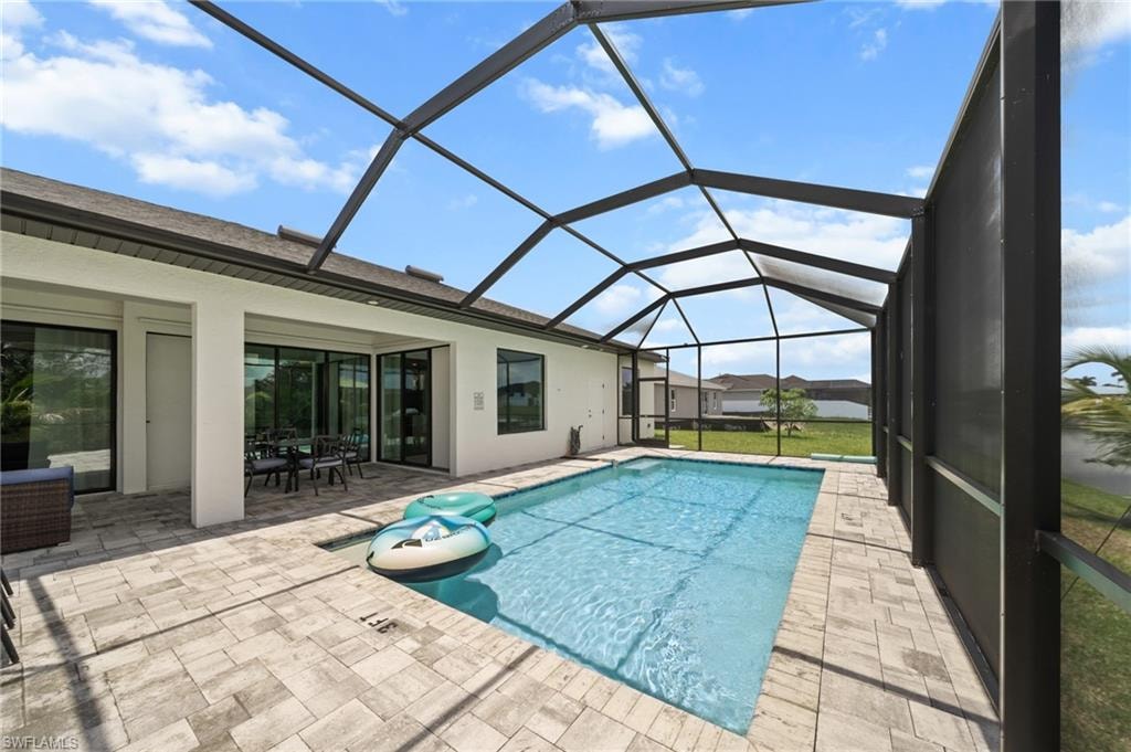 Outdoor pool featuring a patio and a lanai