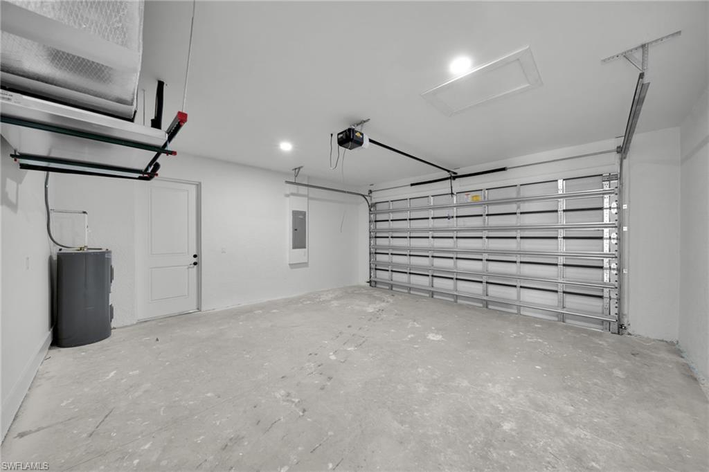Garage with electric water heater and electric panel