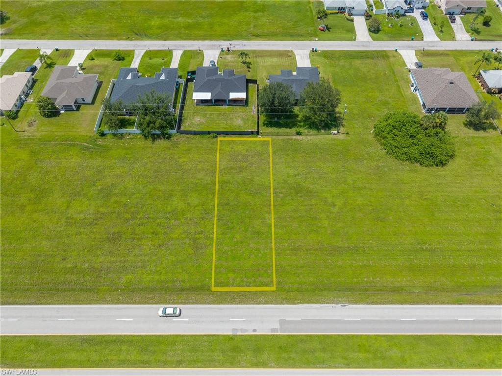 Aerial perspective of suburban area with property boundaries highlighted