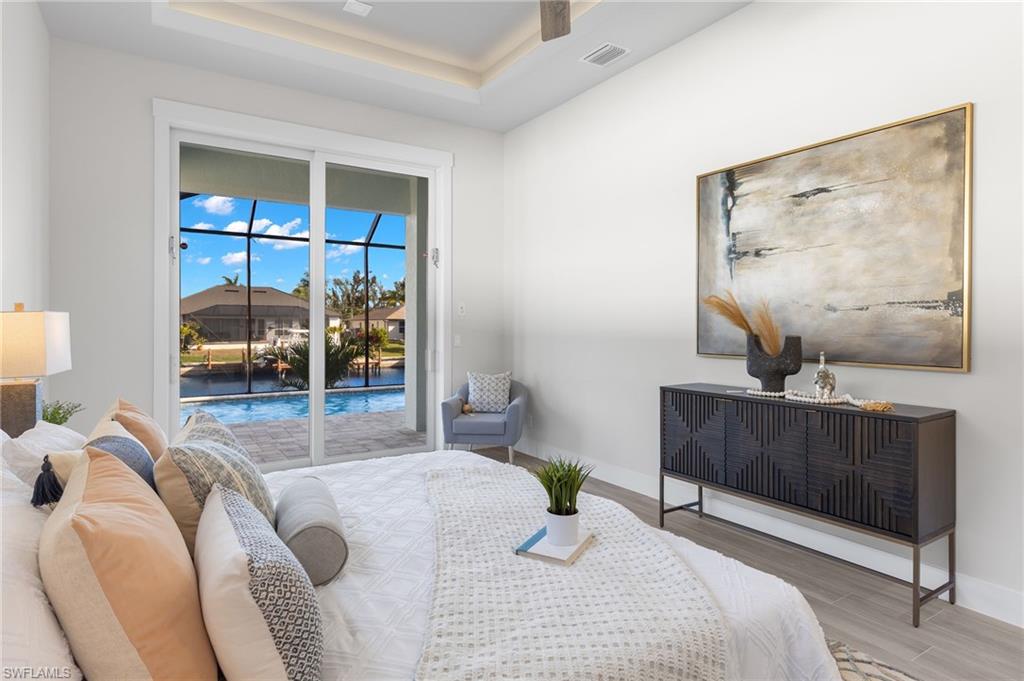 Bedroom featuring access to exterior and light hardwood / wood-style flooring