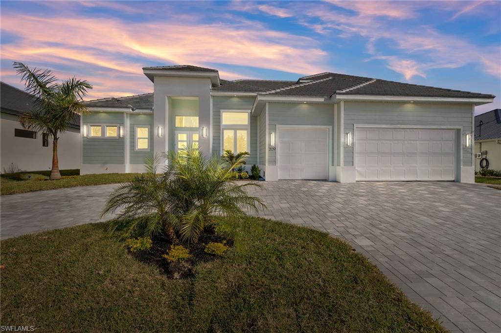 Prairie-style house featuring a garage