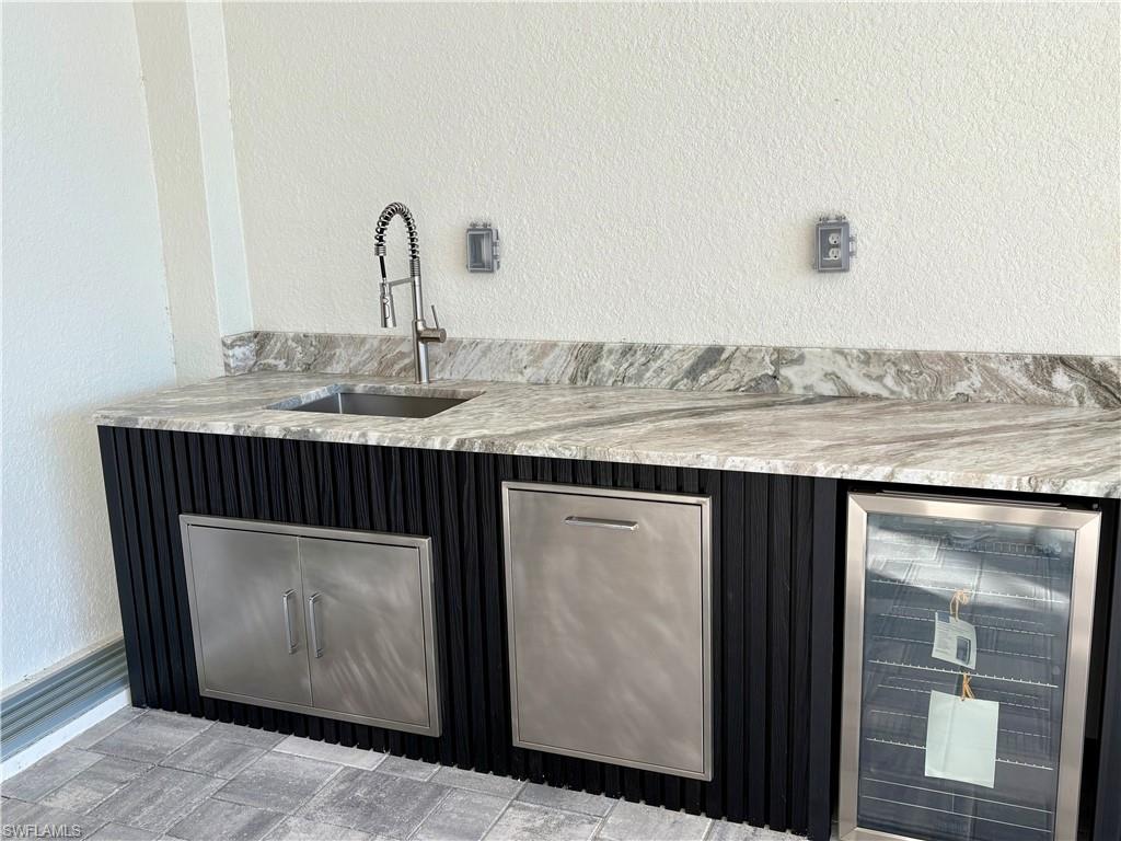 Bar with sink and beverage cooler