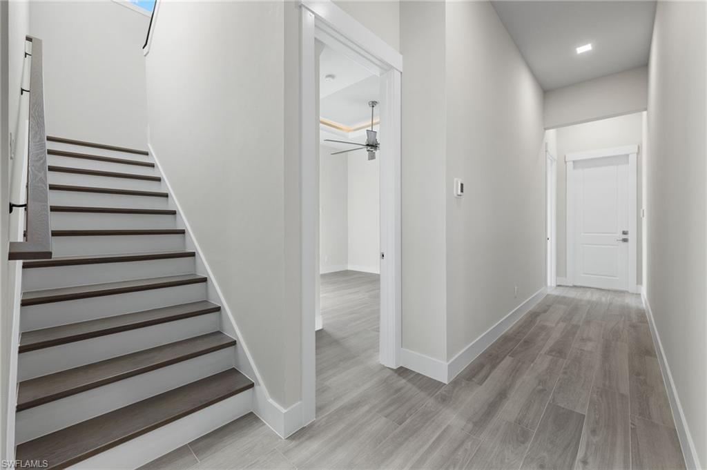 Stairway to 2nd tory bonus room and additional guest room and bathroom