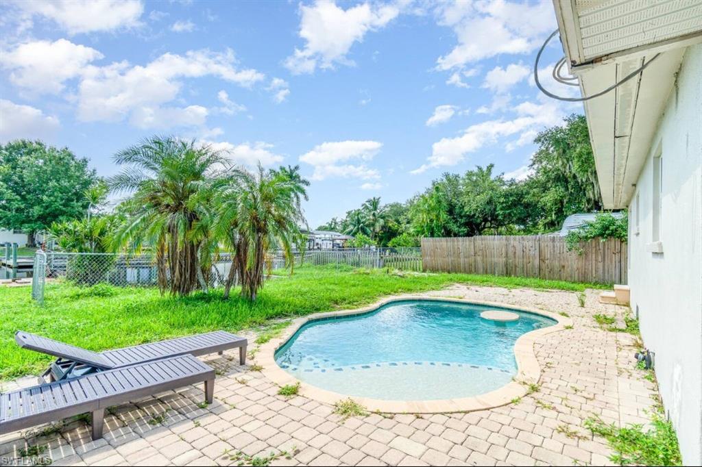 View of swimming pool featuring a patio and a fenced backyard