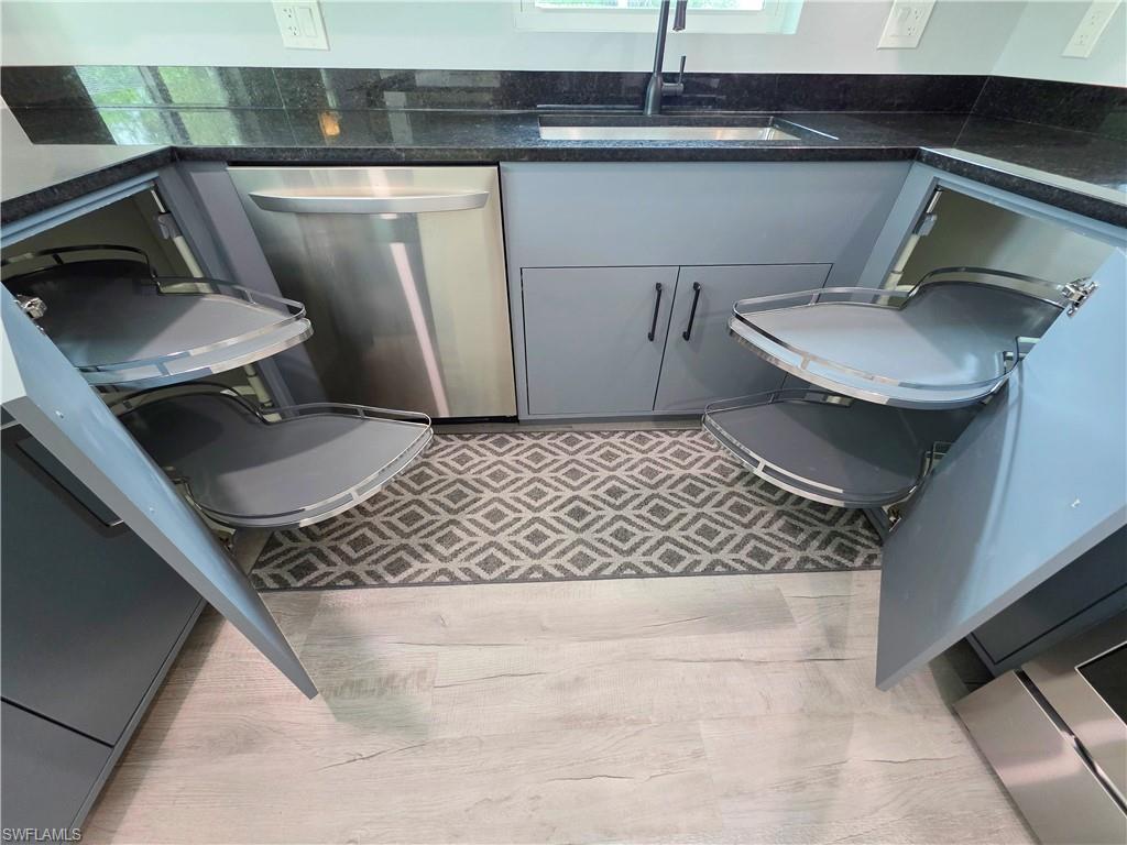 Half bath featuring toilet and vanity