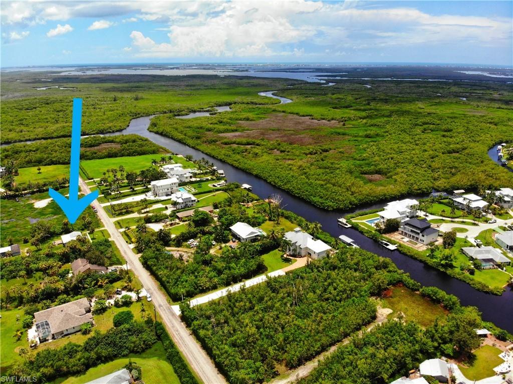 Aerial view of residential area featuring a large body of water