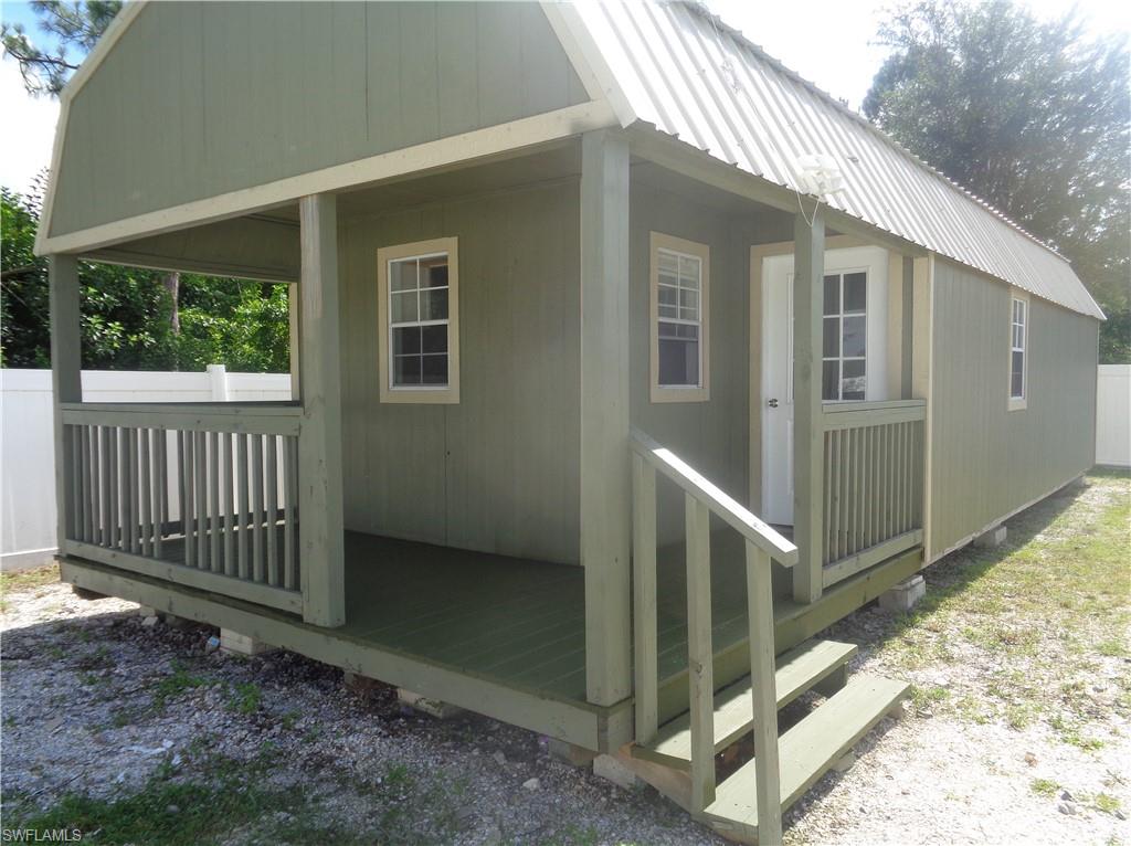 Exterior view of permitted 2bed/1bath appartment featuring a metal roof