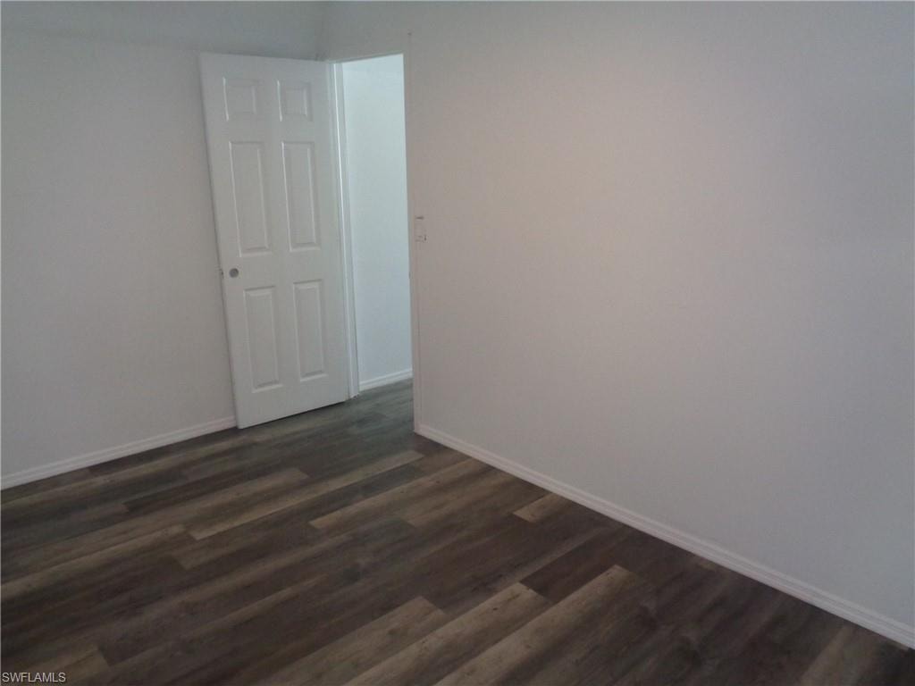 View of unfurnished master bedroom of the permitted 2 bed / 1 bath apartment featuring dark wood-style flooring