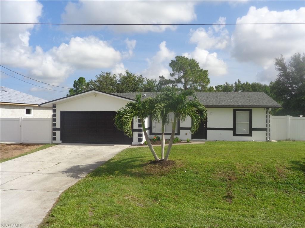 Single story home featuring stucco siding, an attached garage, driveway, and roof with shingles