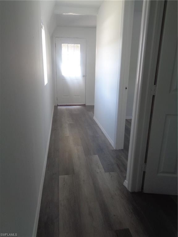 View of the hall of the permitted 2 bed / 1 bath apartment with wood finished floors and baseboards