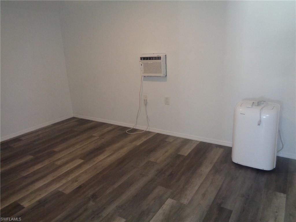 View of unfurnished master bedroom and an AC wall unit of the permitted 2 bed / 1 bath apartment
