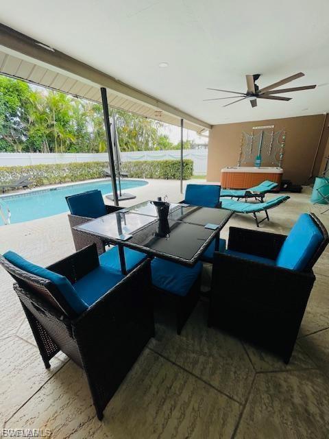 View of patio featuring a ceiling fan